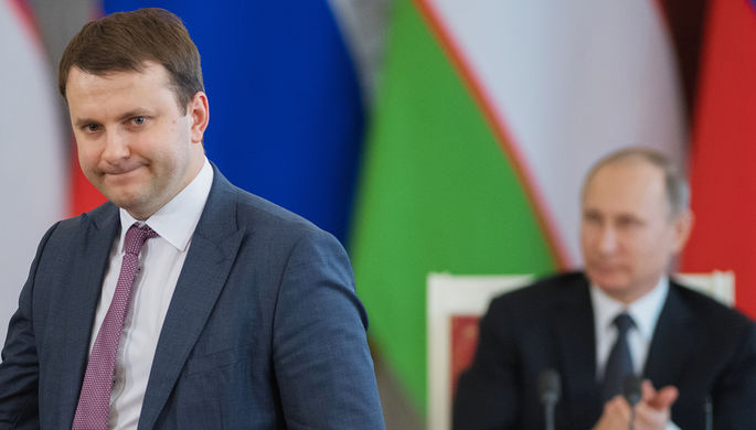 Министр экономического развития России Максим Орешкин и президент Владимир Путин на встрече с...