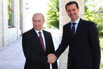 Президент России Владимир Путин и президент Сирийской арабской республики Башар Асад во время встречи в Сочи, 17 мая 2018 года