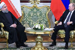Президент Ирана Хасан Рухани и Владимир Путин во время встречи в Кремле