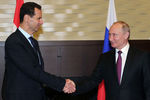 Президент России Владимир Путин и президент Сирийской арабской республики Башар Асад во время встречи в Сочи, 17 мая 2018 года