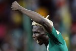 Буркиниец Аристид Бансе празднует выход своей команды в финал Кубка Африки