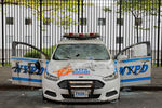 Полицейский автомобиль поврежденный в ходе беспорядков в Бруклине, Нью-Йорк