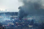 Дым над кварталами в центре Мариуполя, где продолжаются бои, 3 апреля 2022 года