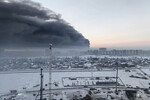 Вид на пожар на складе Wildberries в поселке Шушары из окна ЖК, 13 января 2024 года