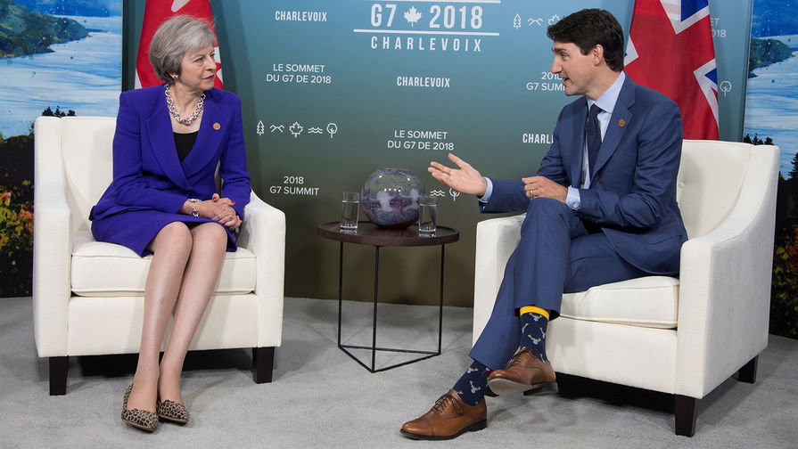 Премьер-министр Великобритании Тереза Мэй и премьер-министр Канады Джастин Трюдо во время саммита G7 в&nbsp;Квебеке, 8 июня 2018 года