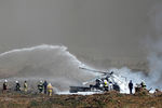 Ликвидация пожара на месте крушения вертолета Ми-28 на авиашоу в Рязанской области
