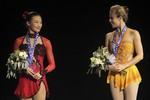 Победительница соревнований у женщин американка Эшли Вагнер и ее соотечественница Кристина Гао