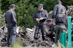 Сотрудники полиции и СК РФ работают на месте крушения самолета Ту-134 авиакомпании «РусЭйр», разбившегося при заходе на посадку недалеко от аэропорта «Петрозаводск (Бесовец)», 21 июня 2021 года