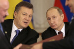Президент России Владимир Путин и его украинский коллега Виктор Янукович во время встречи в Москве, 17 декабря 2013 года