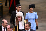 Премьер-министр Великобритании Риши Сунак и Акшата Мурти покидают церемонию коронации короля Карла III и королевы Камиллы, 6 мая 2023 года