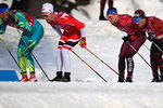 Алексей Полторанин (Казахстан), Дидрик Тёнсет (Норвегия), Андрей Ларьков (Россия) и Йонас Бауман (Швейцария) на дистанции эстафеты 4x10 км среди мужчин в соревнованиях по лыжным гонкам на XXIII зимних Олимпийских играх