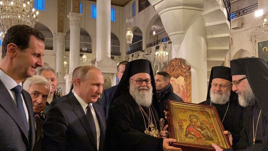 Президент России Владимир Путин и президент Сирии Башар Асад в соборе Пресвятой Богородицы в Дамаске, 7 января 2020 года