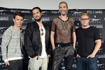 Группа Tokio Hotel: Георг Листинг, Том Каулитц, Билл Каулитц и Густав Шефер (слева направо) на презентации альбома «Kings of Suburbia» в Берлине, 2014 год