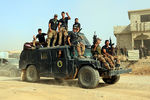 Бойцы элитных иракских антитеррористических сил перед операцией по возвращению Мосула, 15 октября 2016 года