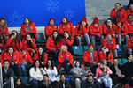 Помощники российских спортсменов на зрительской трибуне во время хоккейного матча Россия-Словения на Олимпиаде в Пхенчхане, 16 февраля 2018 года