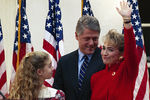 Хиллари и Билл Клинтон с дочерью Челси, 1991 год 