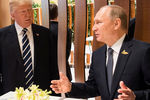 Президент США Дональд Трамп и президент России Владимир Путин на саммите G20 в Гамбурге, 7 июля 2017 года 