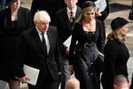 Бывший премьер-министр Великобритании Борис Джонсон с супругой на похоронах королевы Елизаветы II, 19 сентября 2022 года
