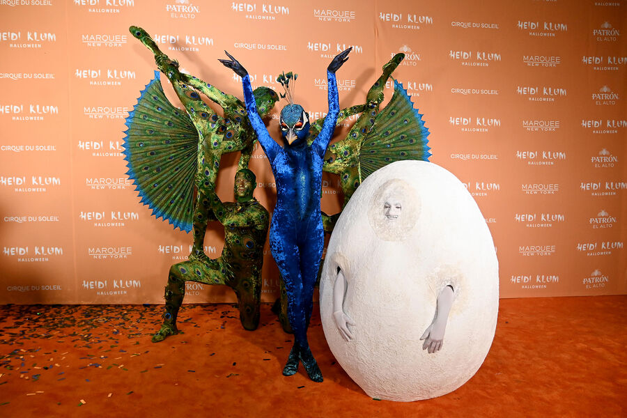 Heidi Klum arrived for Halloween dressed as a peacock and in an egg