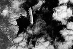17 января. Вид из космоса на круизный лайнер Costa Concordia, потерпевший крушение у берегов итальянского острова Джильо.