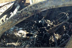 Сгоревший автомобиль на месте гибели фотокорреспондента Андрея Стенина