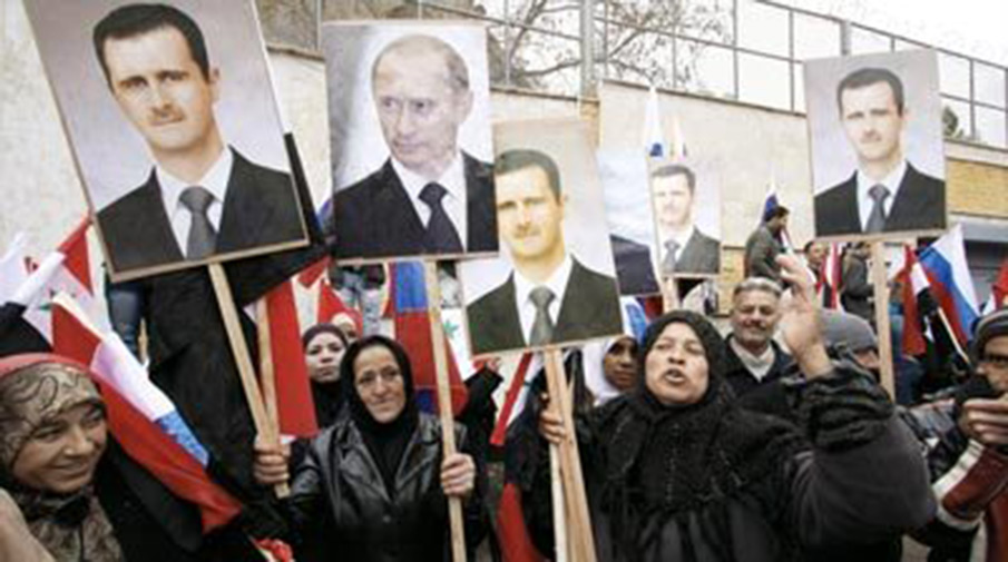 Сирийцы с портретами Владимира Путина и Башара Асада в Дамаске на митинге 15 сентября 2013 года