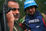 Корреспондент арабской редакции RT Саргон Хадая (справа), попавший под обстрел в Сирии