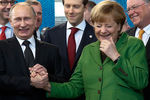 Президент России Владимир Путин и федеральный канцлер Германии Ангела Меркель во время встречи в Ганновере, 2013 год
