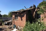 Дом, пострадавший в результате обстрела украинскими силовиками города Горловки Донецкой области