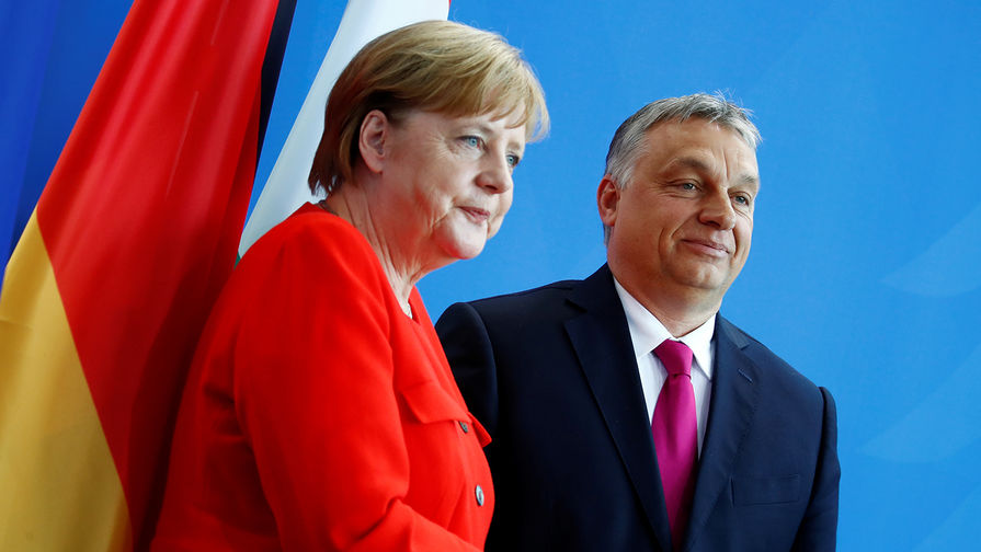 Канцлер ФРГ Ангела Меркель и премьер-министр Венгрии Виктор Орбан во время пресс-конференции в Берлине, 5 июля 2018 года