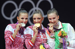Евгения Канаева также является двукратной олимпийской чемпионкой и в командном многоборье