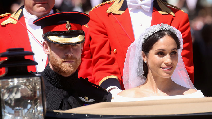 Принц Гарри и Меган Маркл после свадебной церемонии в&nbsp;Виндзорском замке, 19 мая 2018 года