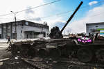 Wreath on a damaged tank of the DPR People's Militia on Kuprin Street in Mariupol, March 2022