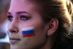 Зрительница во время праздничного концерта на Красной площади, посвященного Дню России