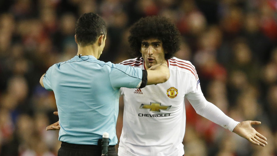 Football Soccer &mdash; Liverpool v Manchester United &mdash; UEFA Europa League Round of 16&nbsp;First Leg &mdash; Anfield, Liverpool, England &mdash; 10/3/16
Referee Carlos Velasco Carballo talks to Manchester United's Marouane Fellaini
Action Images via Reuters / Carl Recine
Livepic
EDITORIAL USE ONLY.