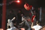 Red Star Belgrade fans clash with riot police in the stadium before their Serbian Superliga soccer match against Partizan Belgrade in Belgrade, 