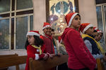 Жители Дамаска в церкви во время празднования Рождества по григорианскому календарю