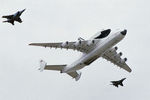 Транспортировка космического корабля «Буран» с помощью транспортного реактивного самолета Ан-225 «Мрия» в сопровождении истребителей МиГ-25 и Су-27