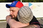 Рэпер Баста (Василий Вакуленко) с болельщиком во время матча 4-го тура чемпионата России по футболу среди клубов профессиональной футбольной лиги (зона Юг) между командами «СКА-Ростов» (Ростов-на-Дону) и ФК «Машук-КМВ» (Пятигорск), 2019 год