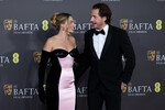 Актриса Марго Робби и ее муж, режиссер Том Акерли, на 77-й церемонии вручения премии BAFTA, 18 февраля 2024 года
