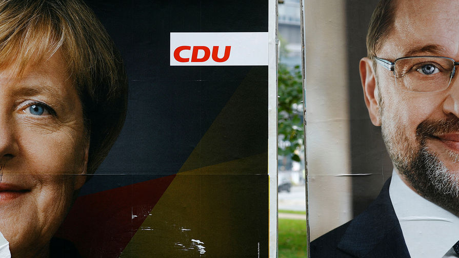 Постеры с изображением лидера «Христианско-демократического союза Германии» Ангелы Меркель и председателя «Социал-демократической партии Германии» Мартина Шульца во Франкфурте, сентябрь 2017 года