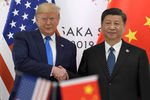 Президент США Дональд Трамп и председатель Китайской Народной Республики (КНР) Си Цзиньпин во время встречи на полях саммита G20, 29 июня 2019 года