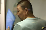Один из членов банды GTA Анвар Улугмурадов во время оглашения приговора пятерым членам банды GTA, обвиняемых в убийствах и бандитизме, в Московском областном суде, 9 августа 2018 года