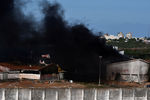 Дым над тюрьмой Alcacuz на северо-востоке Бразилии во время беспорядков, 19 января 2017 года