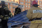 Сотрудники МЧС во время разбора завалов на месте обрушения после взрыва торгового центра, 12 февраля 2021 года 