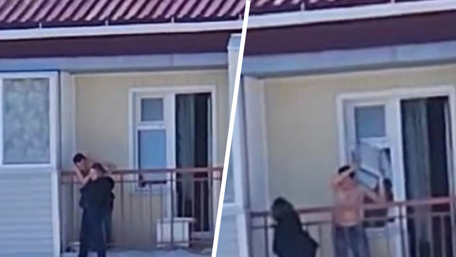 Россиянин пытался сбросить девушку с балкона и попал на камеру