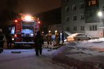 На месте пожара в девятиэтажном жилом доме в Екатеринбурге, 12 января 2021 года
